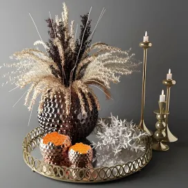 Bouquet of dried flowers in a glass vase on a tray